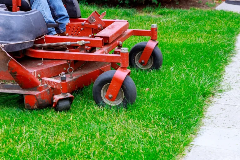 Commercial grounds with turf and trees by 2 Guys and a Mower KG